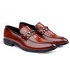 Pair of brown loafers with metallic buckles on a white background